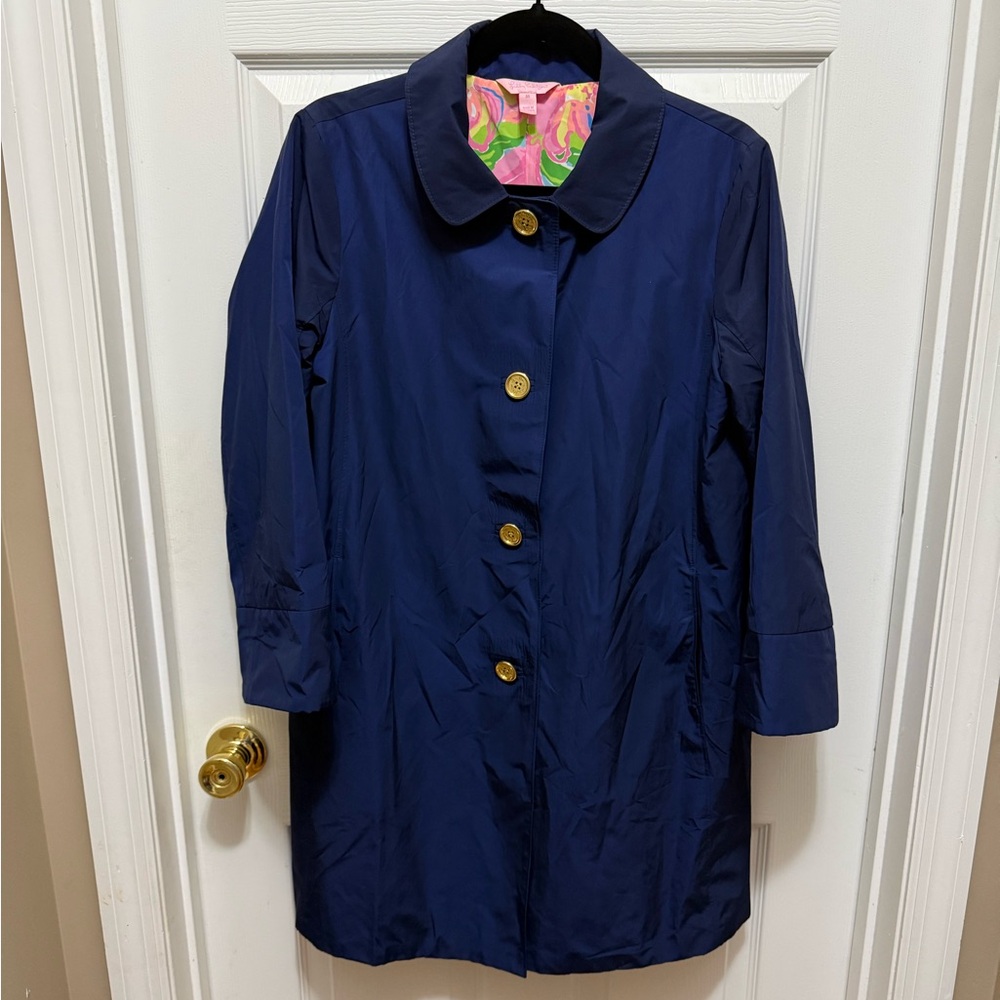 Lilly Pulitzer Palm Beach Jacket in navy with a colorful floral print lining.
